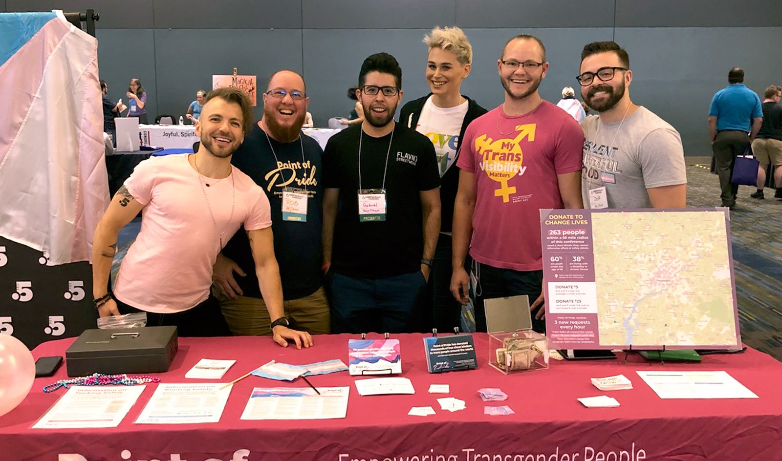 2017 recipient Gabriel (center) with Point of Pride leadership and volunteers