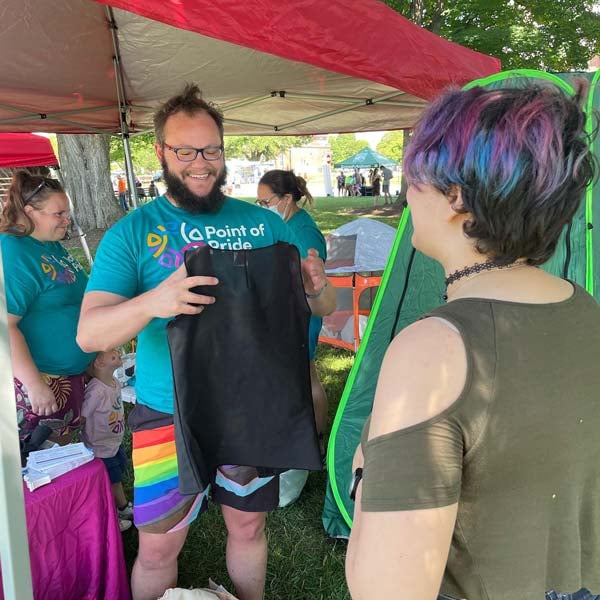 Tyler explaining how a chest binder should fit to recipient