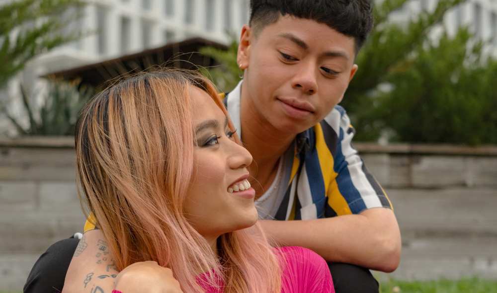 Two trans people enjoying a moment in the park