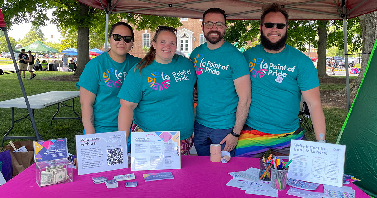 Point of Pride volunteers at table