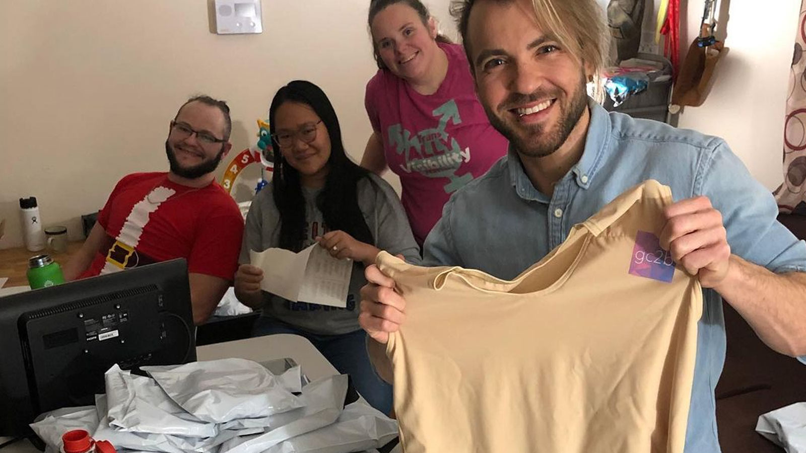 Volunteers packaging binders