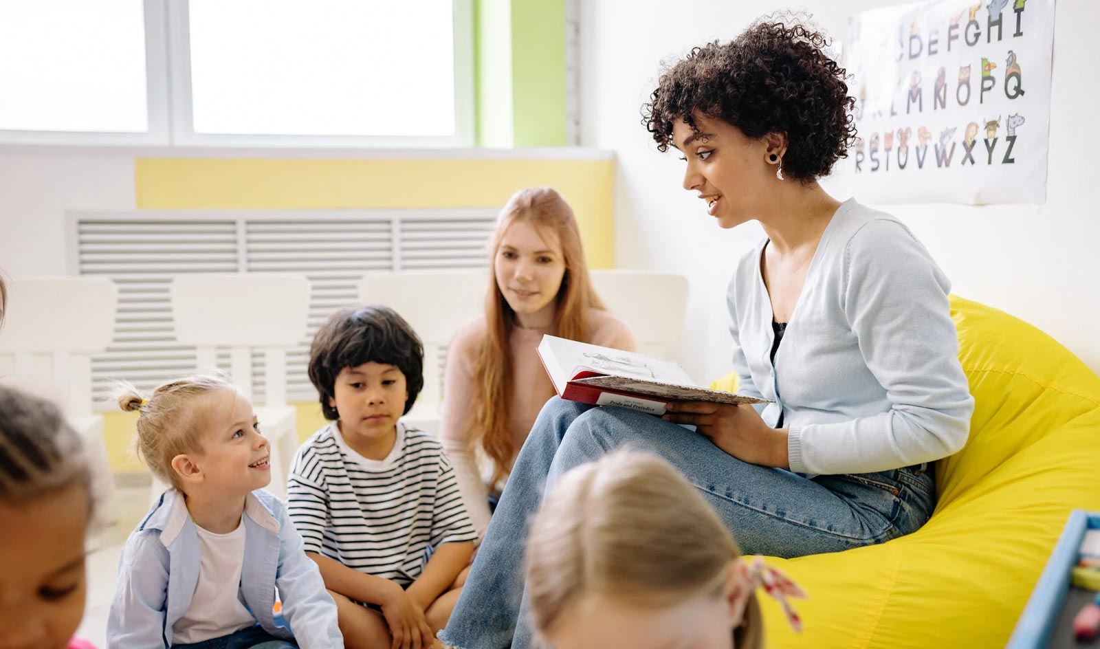 Teacher reading to group of students