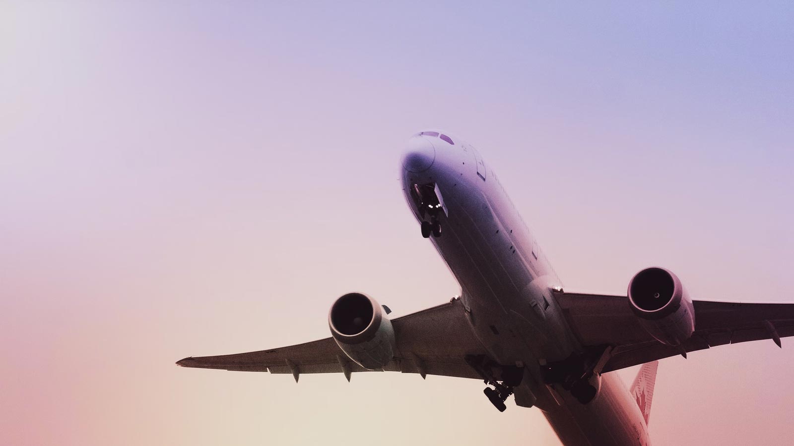 Airplane flying through hazy sky