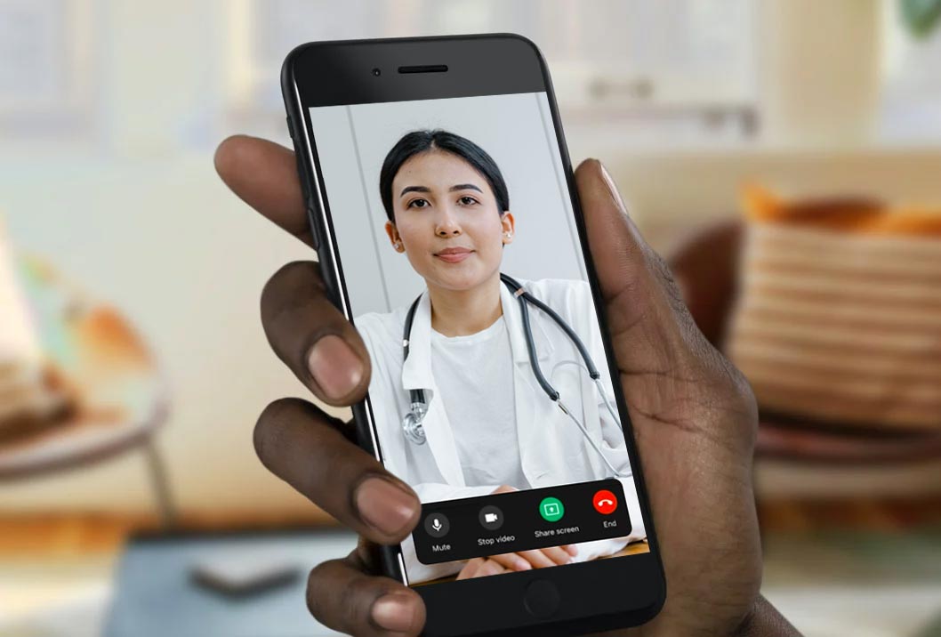 Close-up of hand holding smartphone showing telemedicine video call