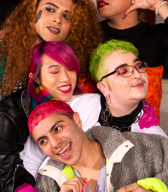 A group of trans young people smiling together A group of trans young people smiling together